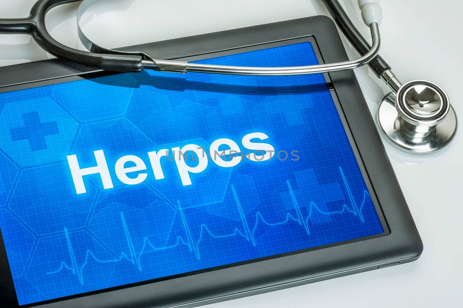 Tablet with the diagnosis herpes on the display