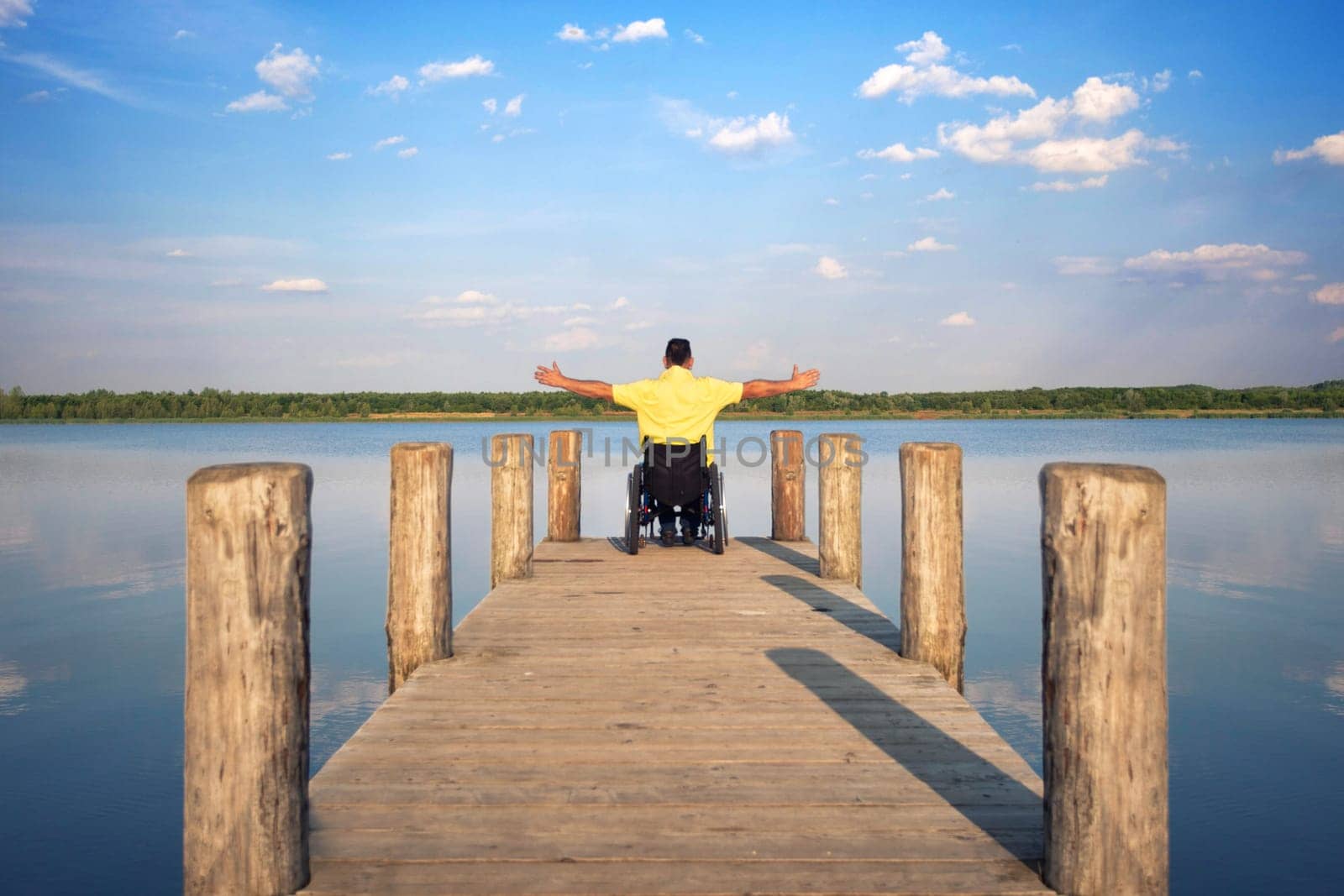 Wheelchair users in summer at the lake