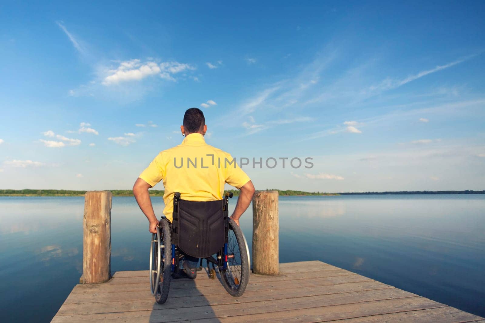 Wheelchair users in summer at the lake