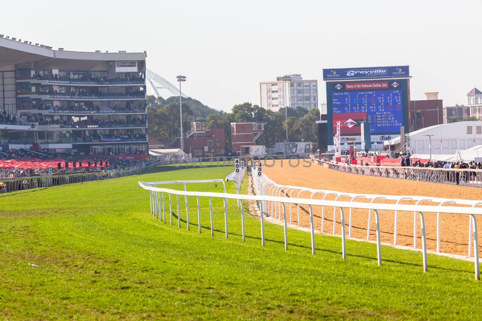 Horse racing action of jockeys races at Greyville racecouse sand and grass for Durban July vodacom cup.