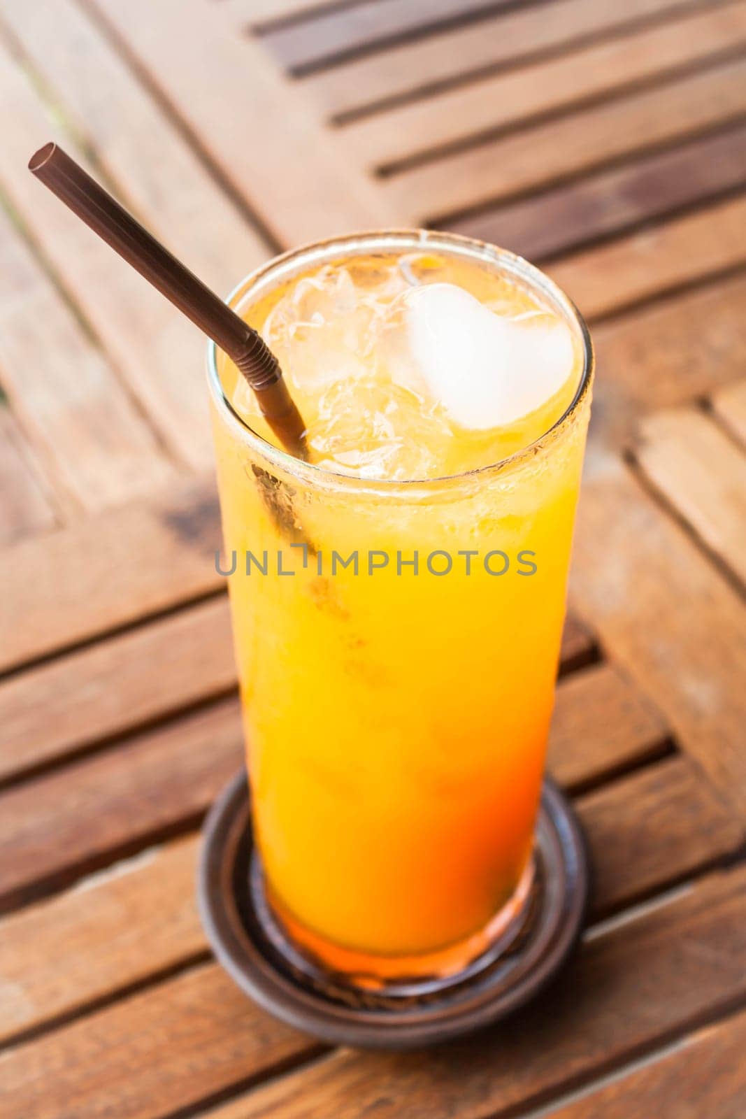 Fresh orange juice with heart ice cube