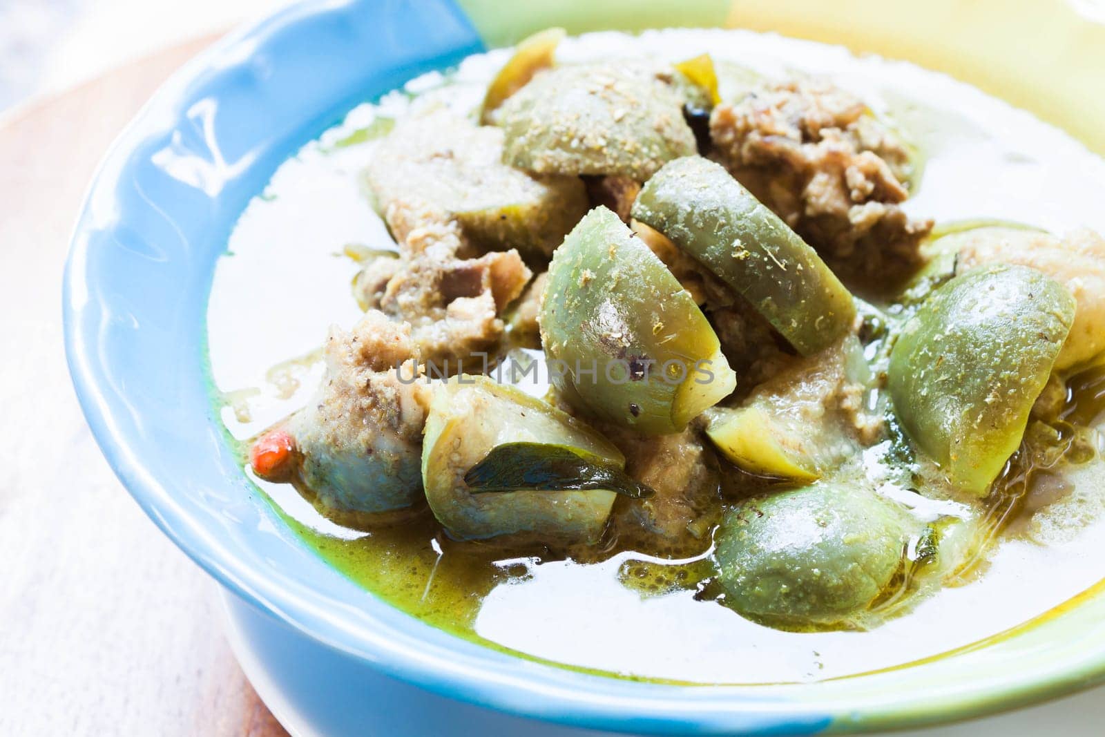 A bowl of spicy green curry, thai traditional food