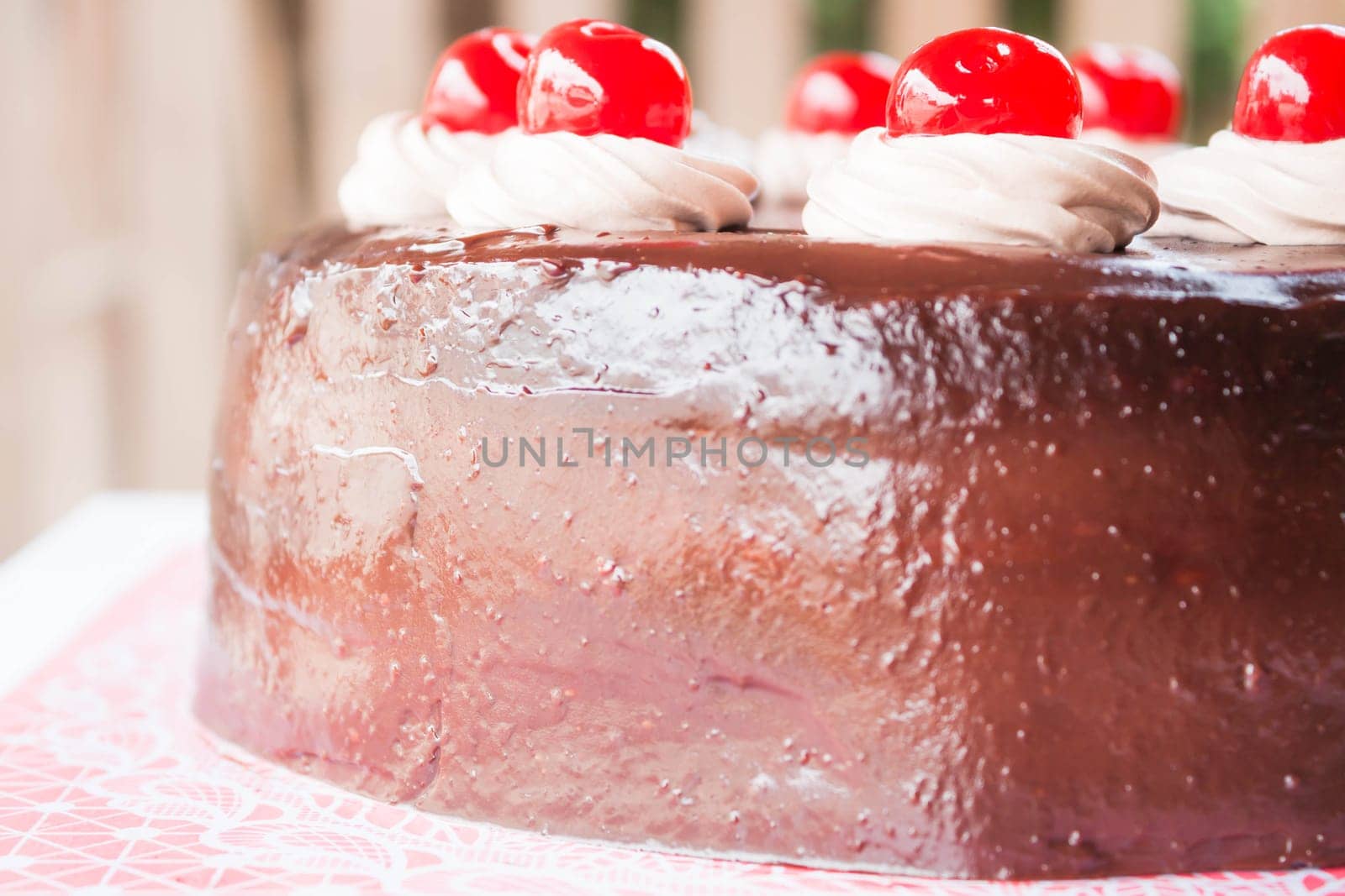 Delicious chocolate cake with cherry on top