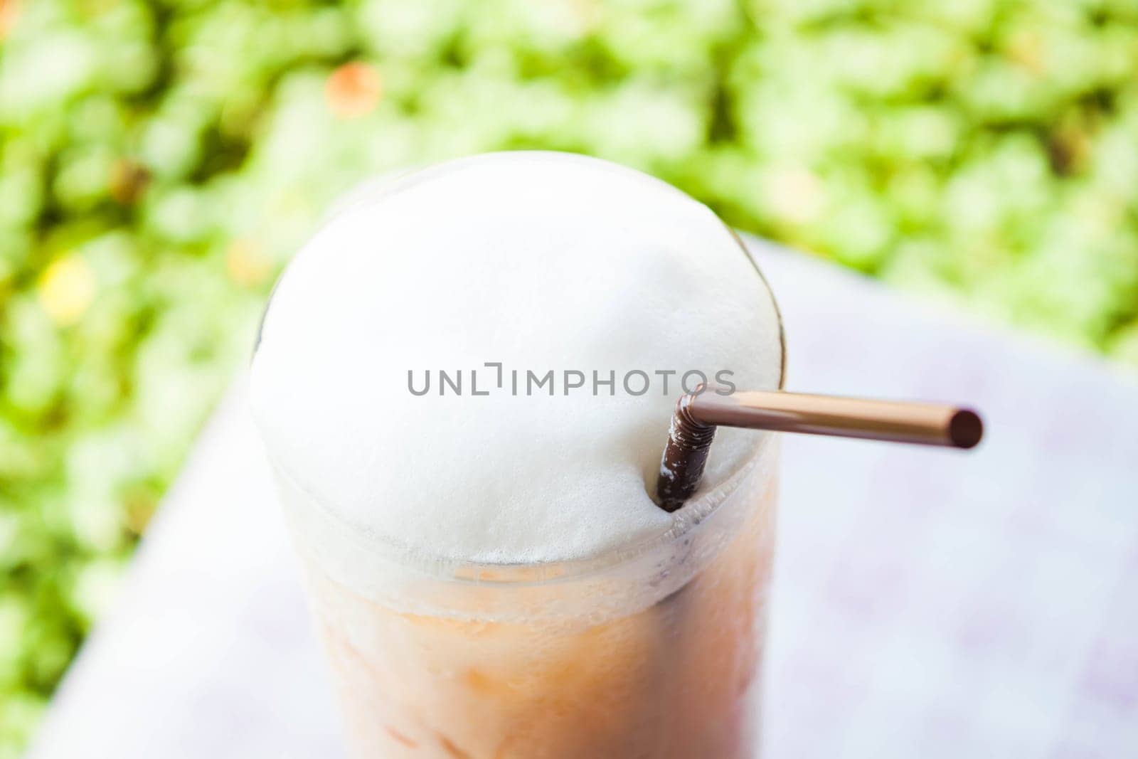 Iced thai milk tea with milk foam