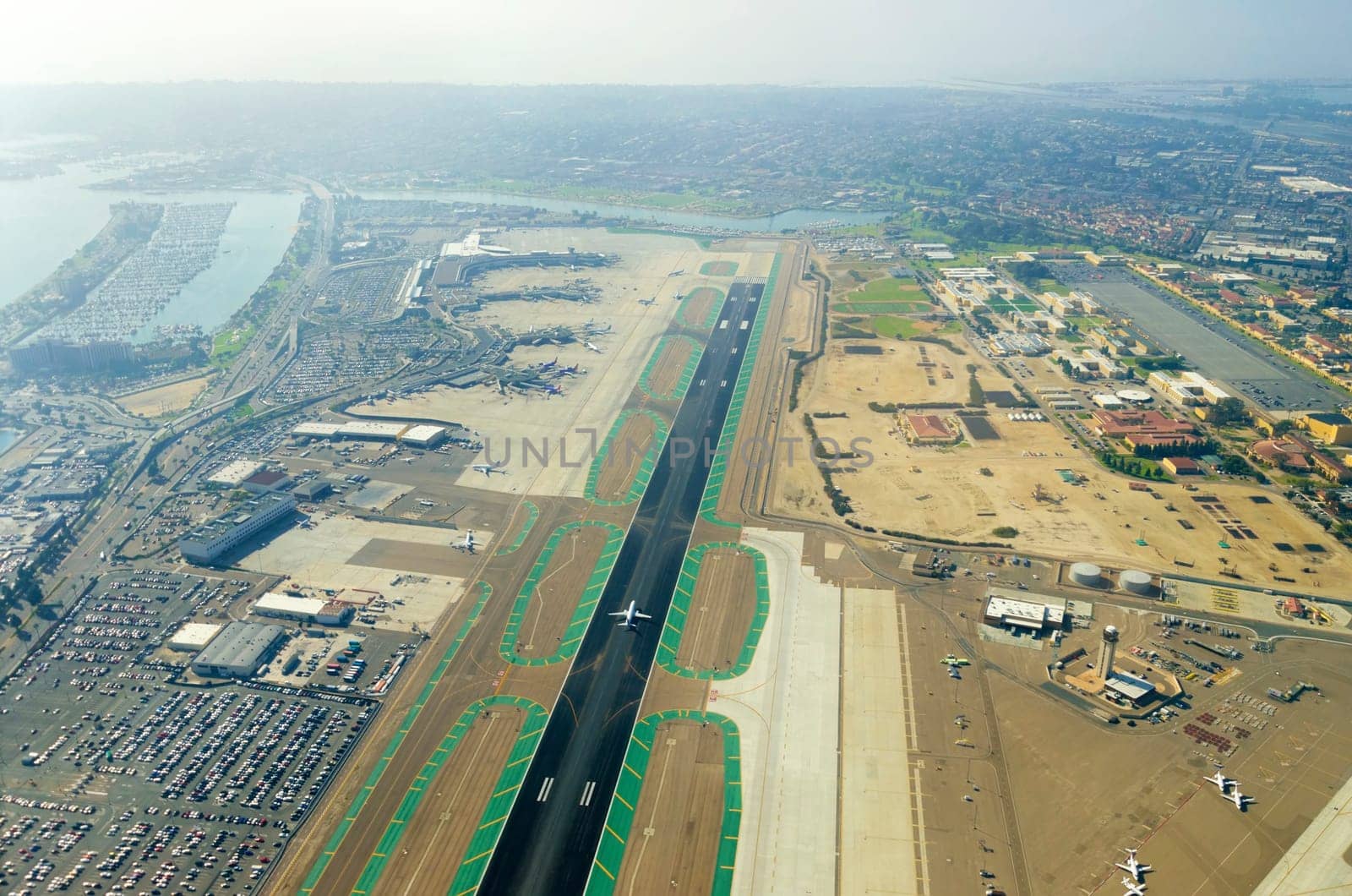 Aerial view of the San Diego International Airport, river and pacific ocean, in Southern California. Lindbergh Field is the busiest single runway commercial airport in the United States of America.