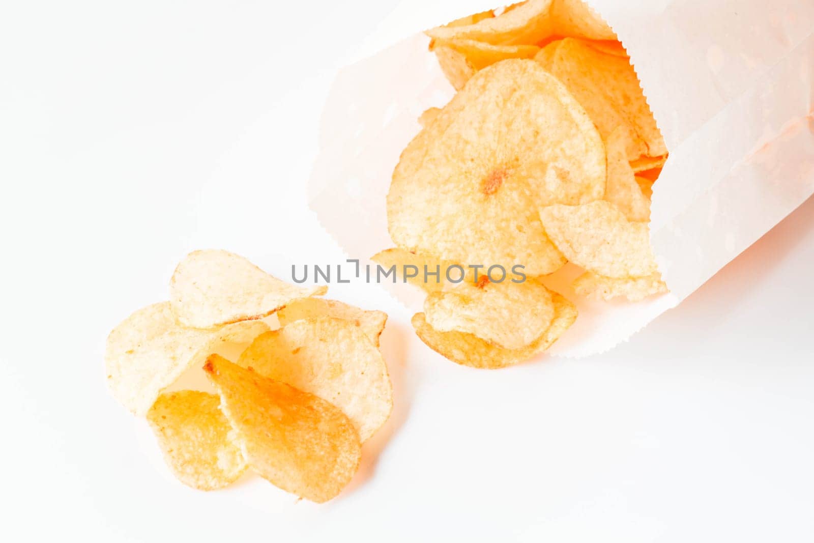 Potato chips snack falling out of the pack