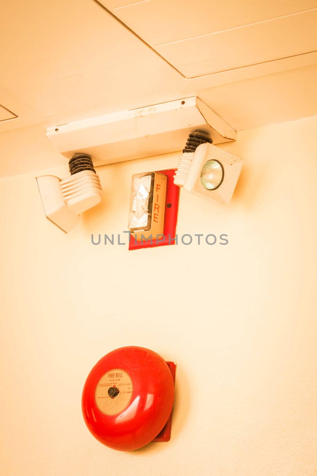 Red fire alarm bell in the building