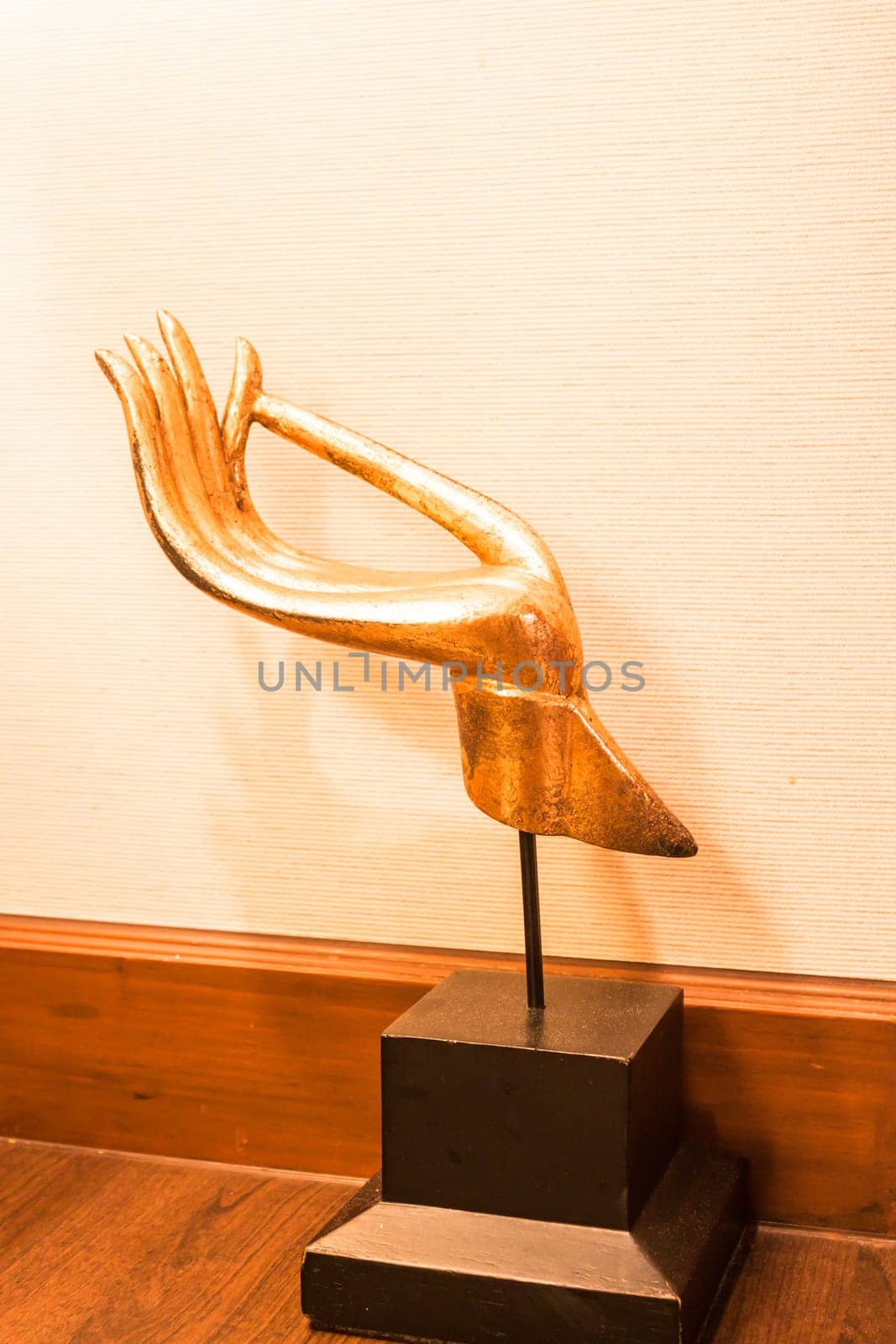 Gold wood carved hand sculpture decorate on table