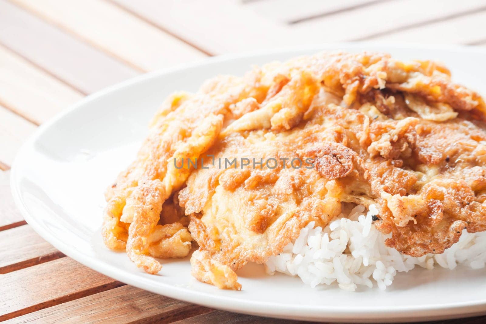 Classical plain egg omelet topped on rice