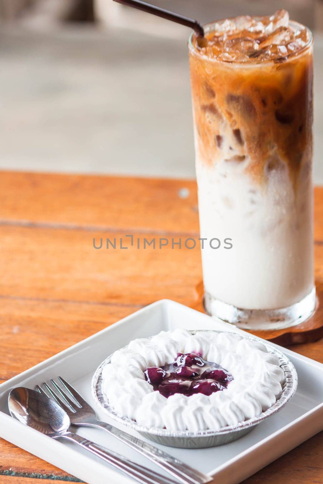 Blueberries cheese cupcake and cold coffee latte