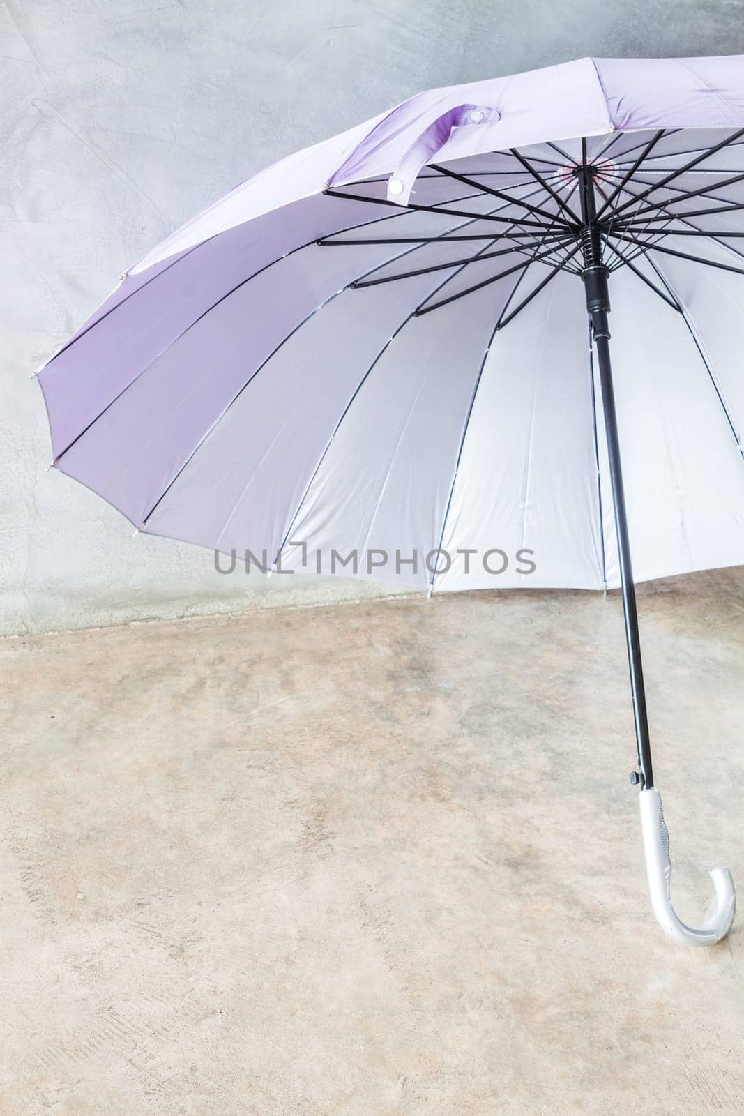 Violet silver bronze uv protection umbrella on the floor