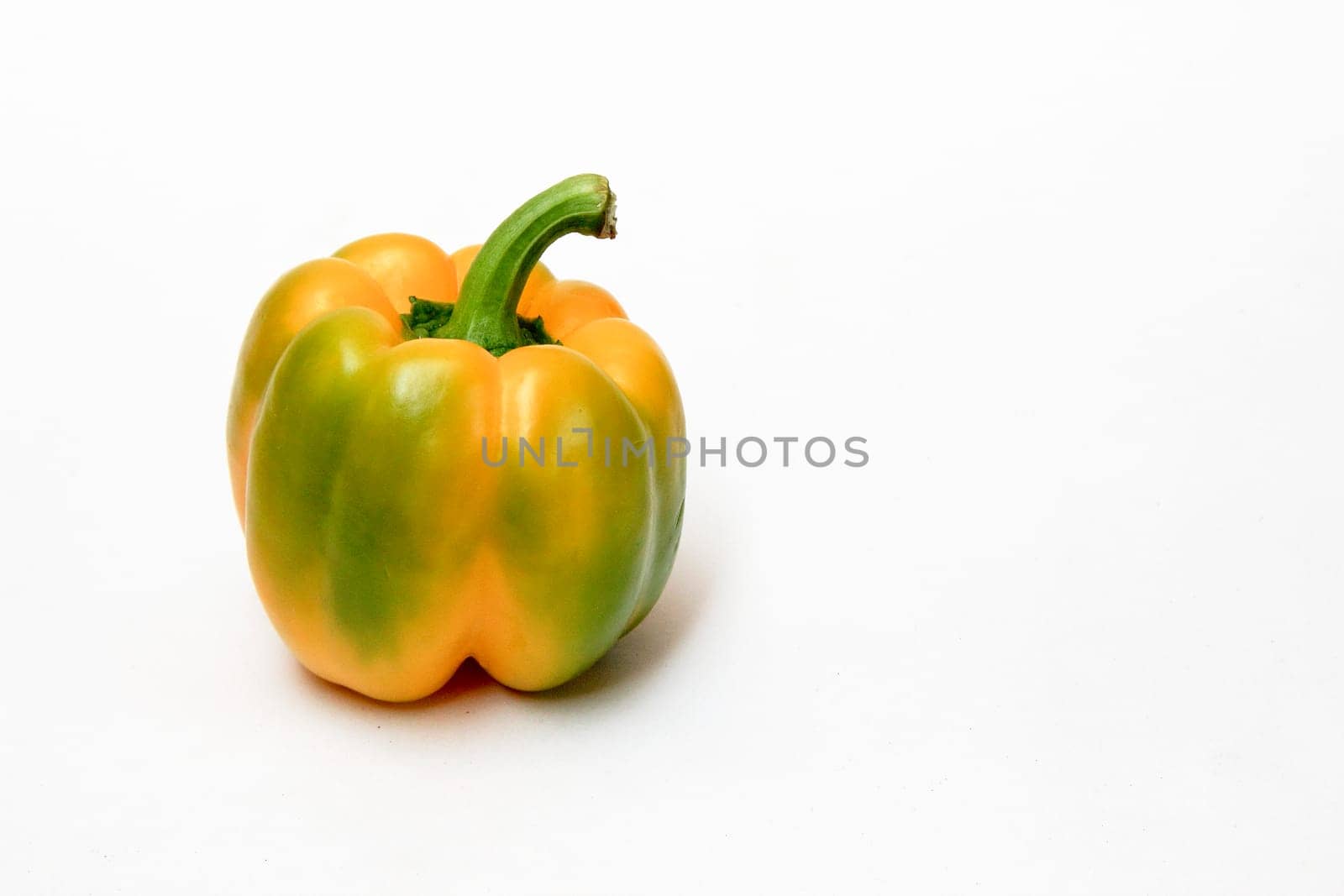 Greenish yellow, fleshy capsicum, isolated on white background