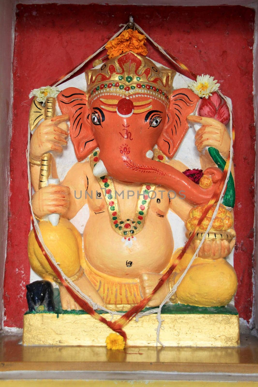 Statue of Ganesha painted pink and red at City Palace, Udaipur, Rajasthan, India, Asia