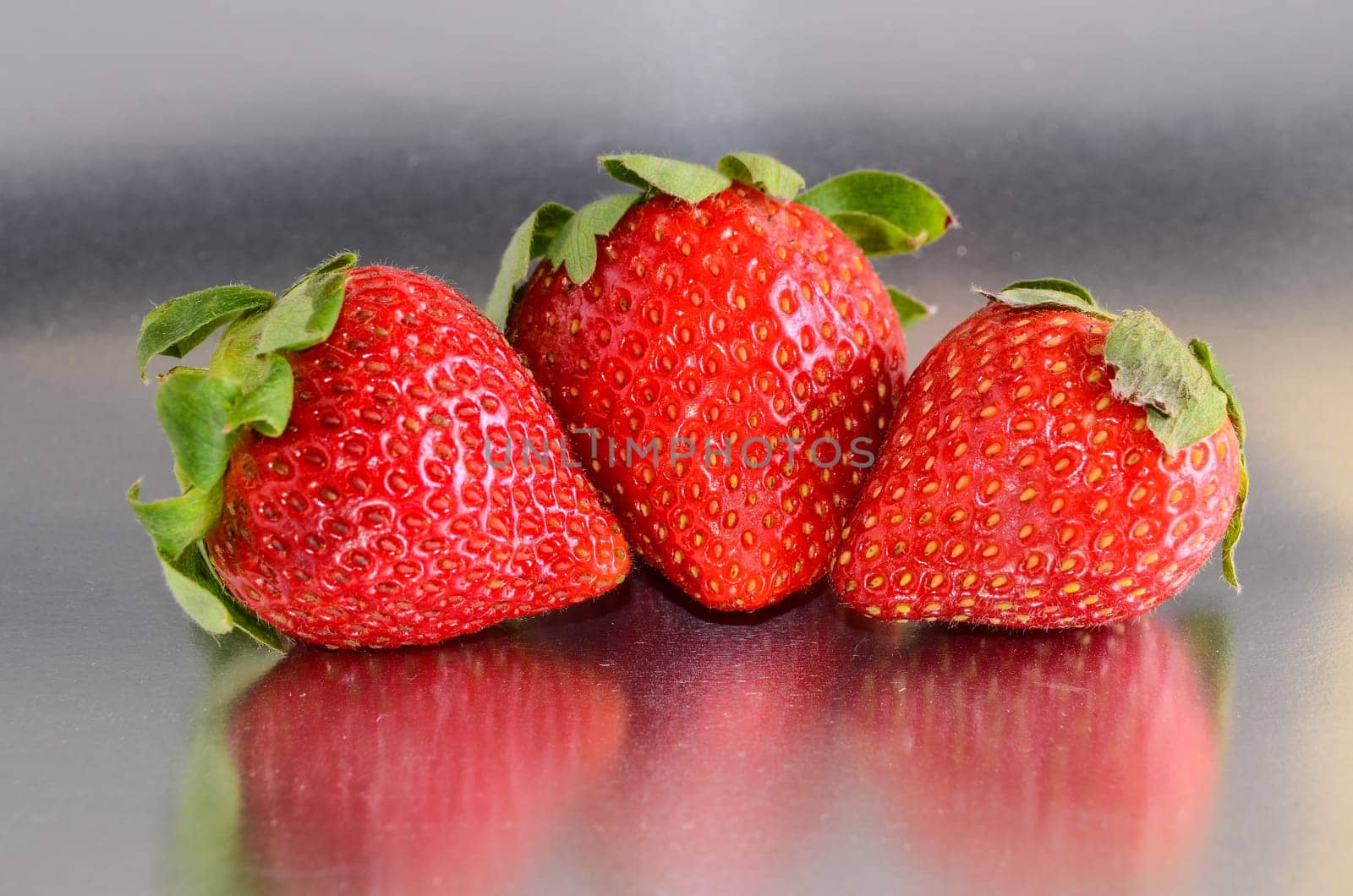 Fresh Ripe Strawberry Fruit on a Colored Background