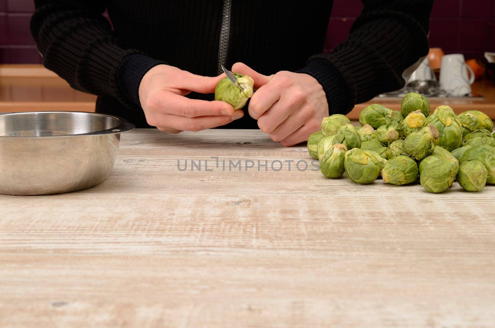 Cutting some sprouts in a kitchen