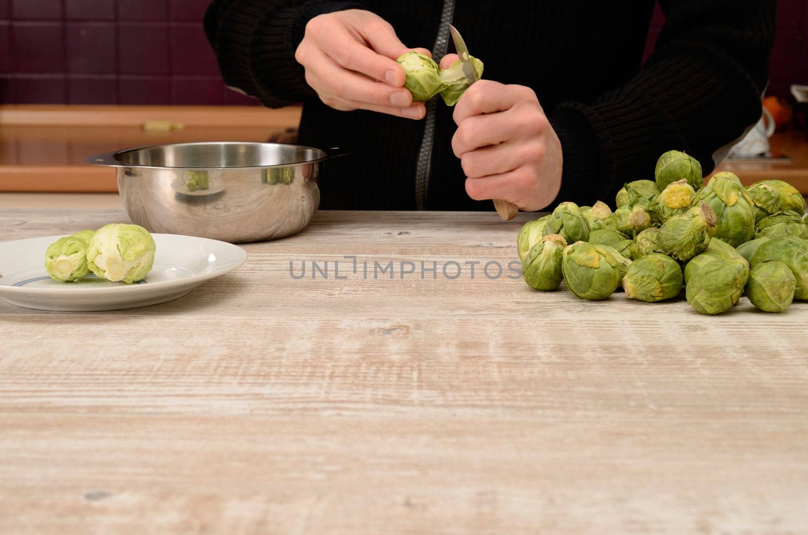 Cutting some sprouts in a kitchen