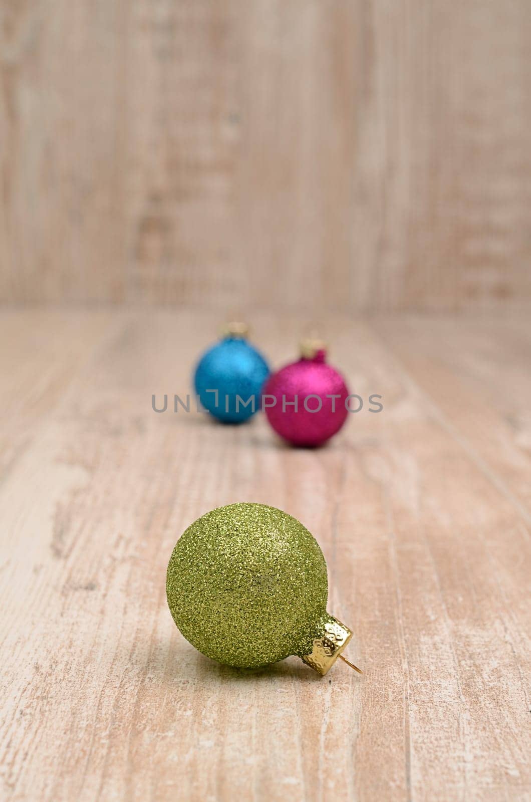 Christmas baubles on a rustic wooden background