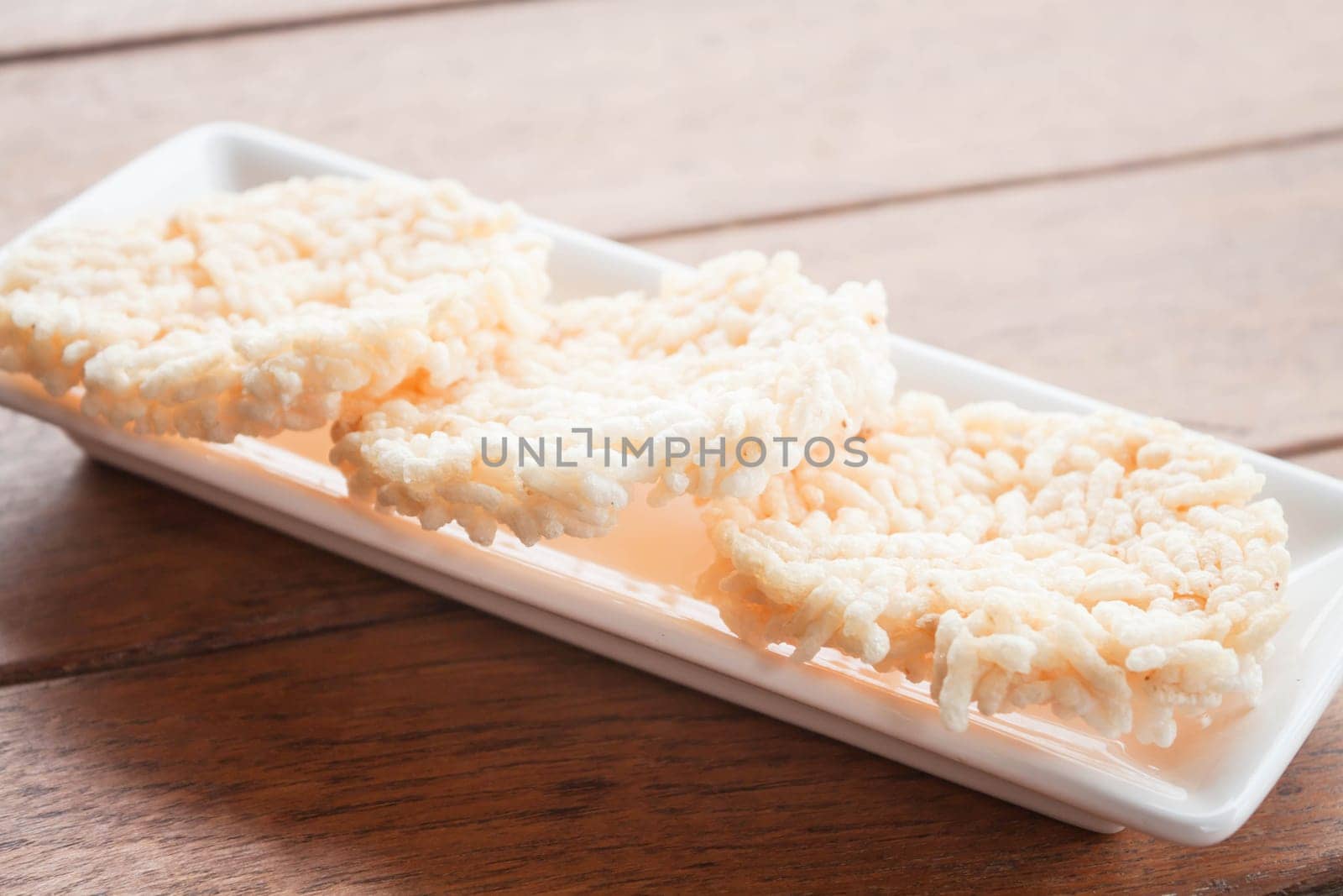 Traditional crispy rice cracker on white plate