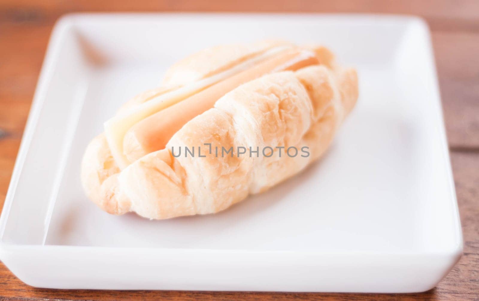 Mini croissant filling with sausage and cheese