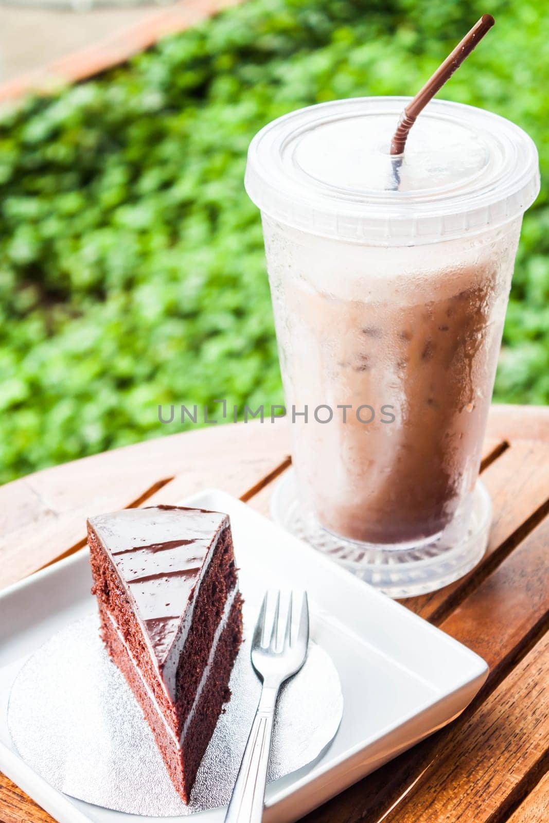 Refreshing break with cold coffee and chocolate cake