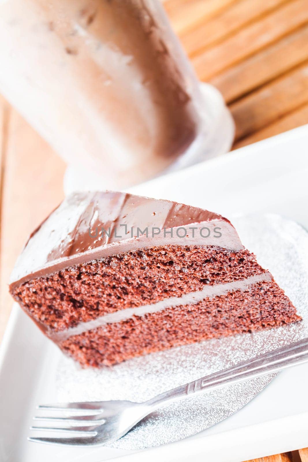 Bitter sweet meal with cold coffee and chocolate cake
