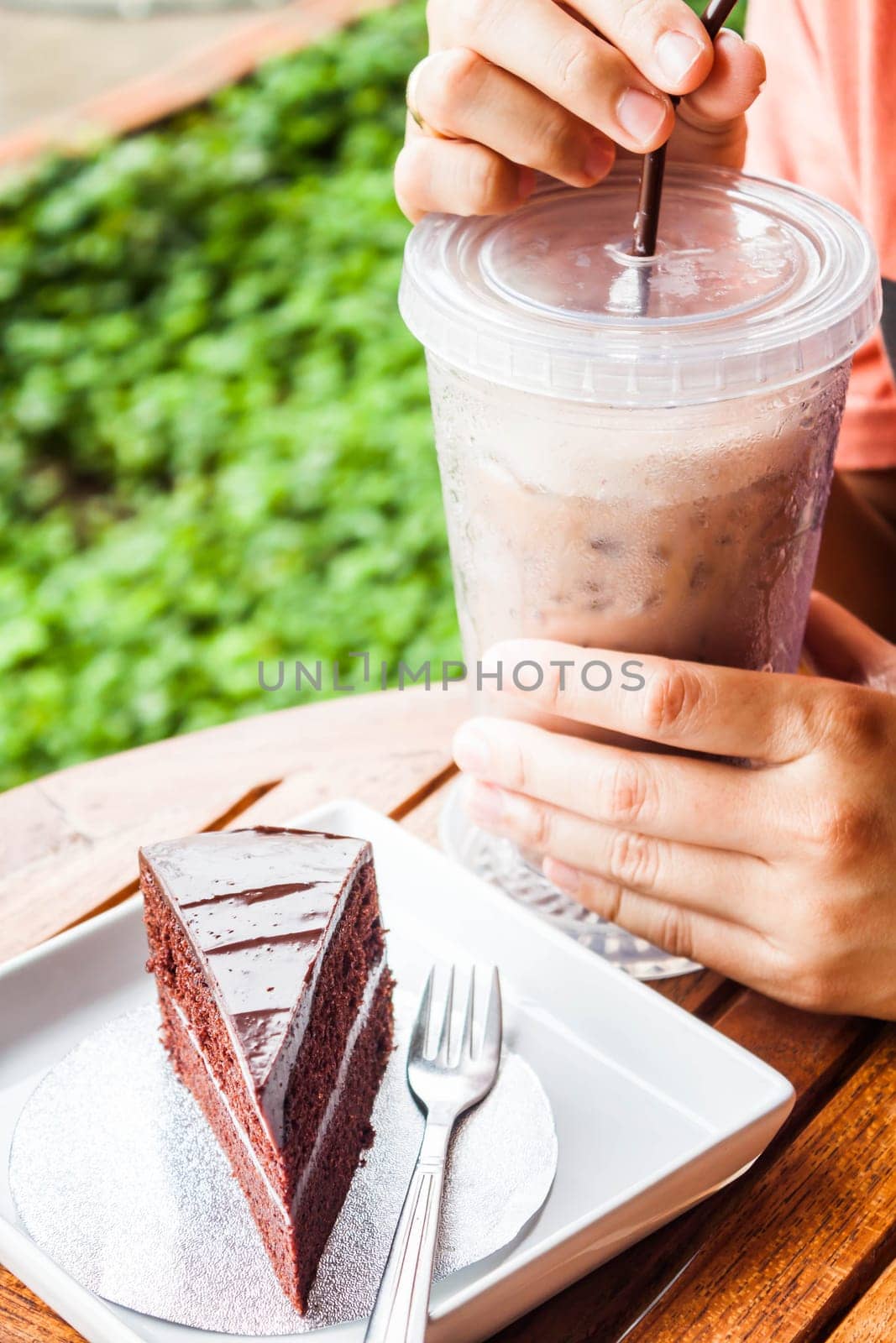 Refreshing break with iced coffee and chocolate cake