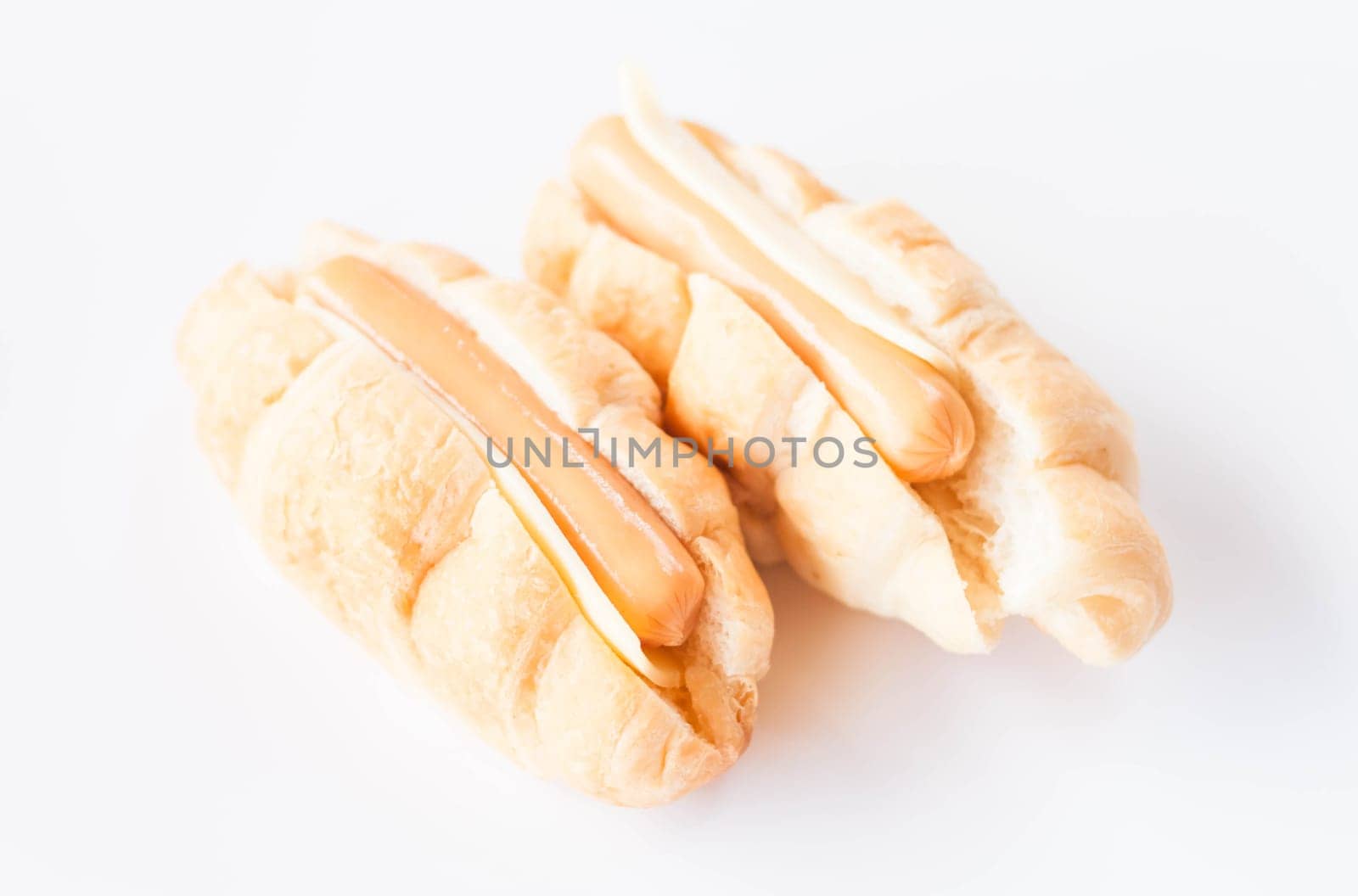 Croissants with cheese and sausage isolated on white background