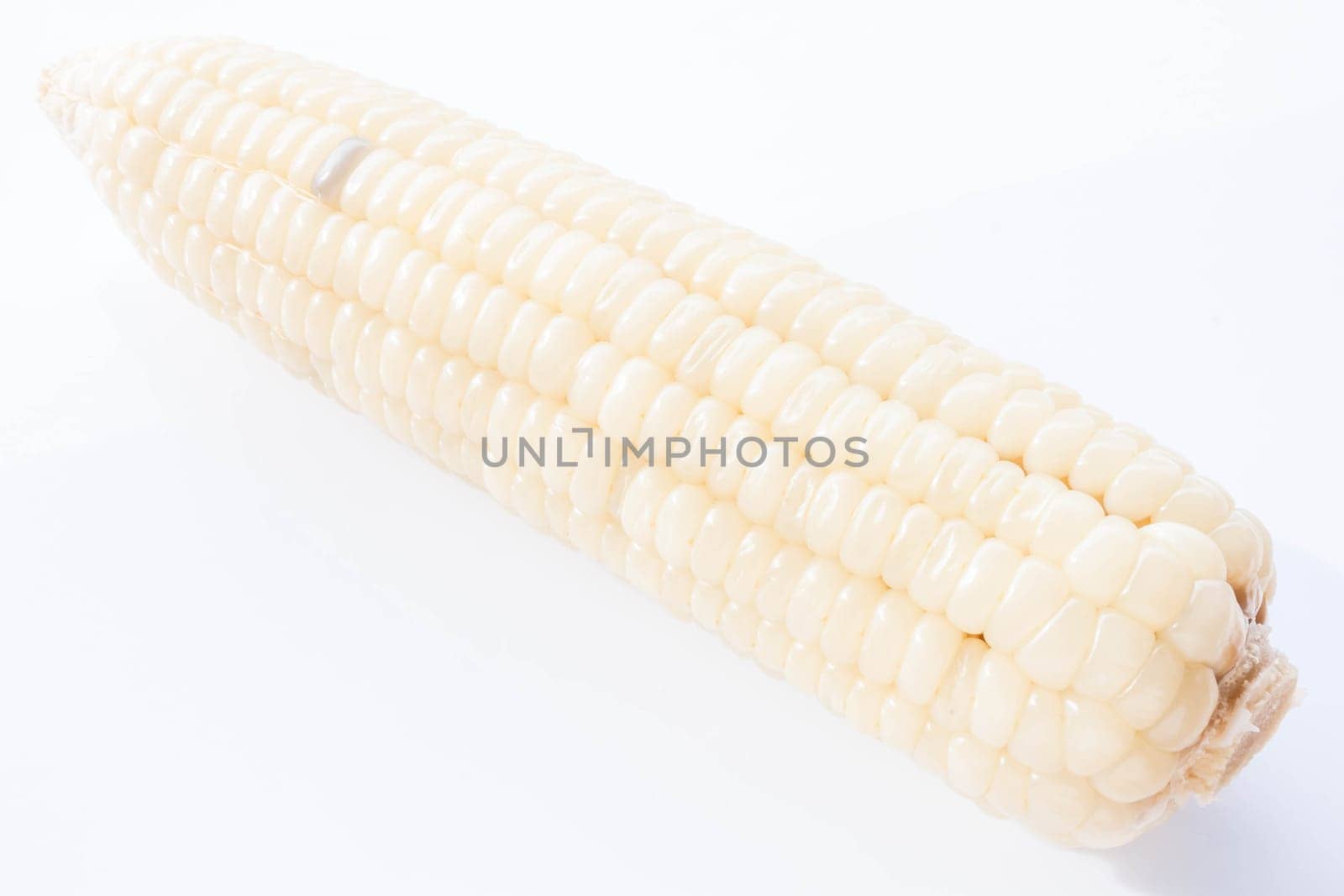 Yellow boiled corn cobs isolated on white background, stock photo