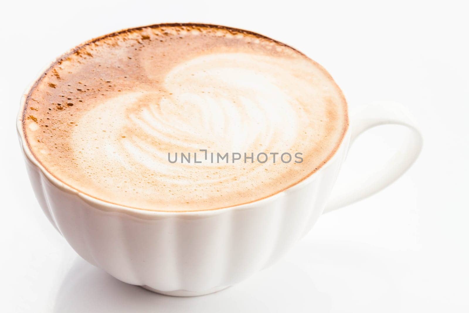 Hot coffee latte with free pour art isolated on white background