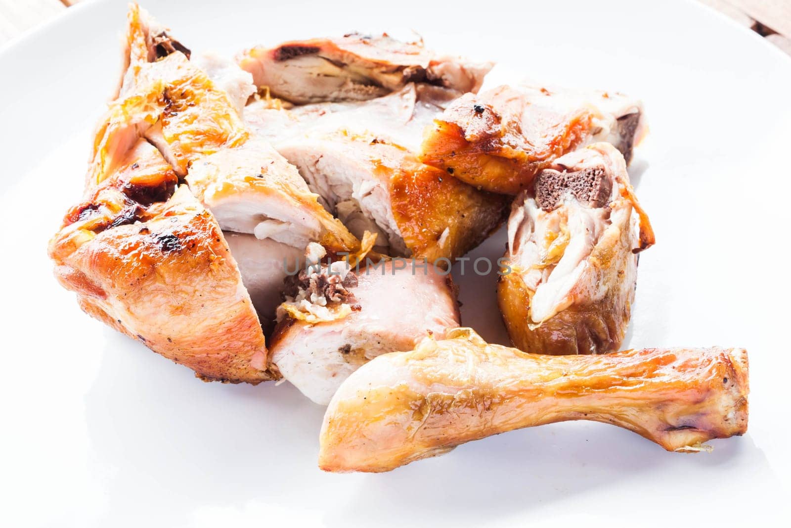 Grilled chicken on plate, stock photo