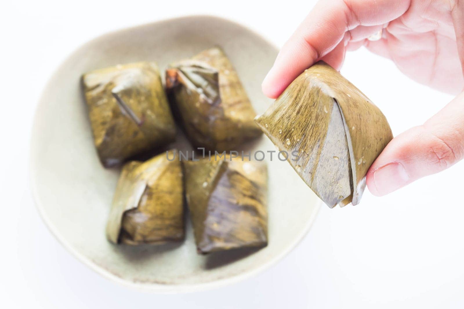 Hand hold stuffed dough pyramid dessert