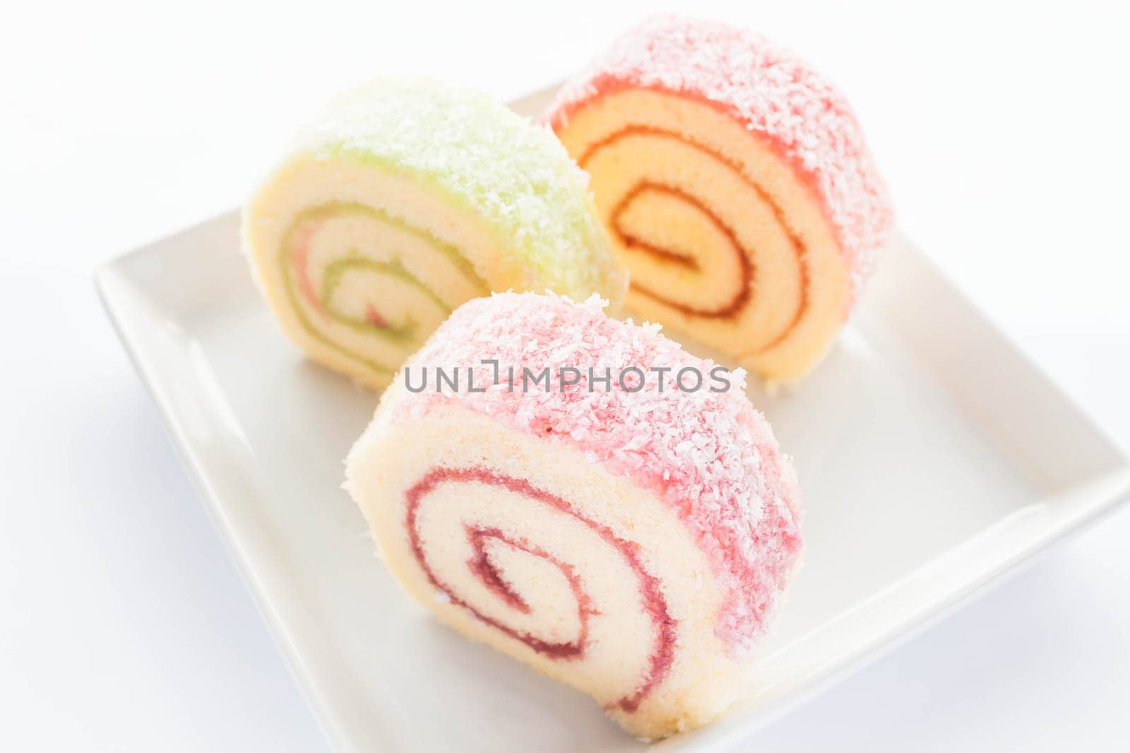 Colorful jam roll cakes  on the dish, stock photo