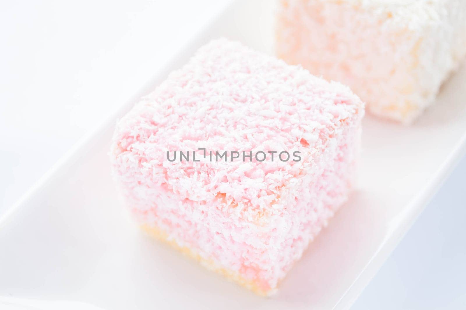 Lamington sponge cakes on the plate, stock photo