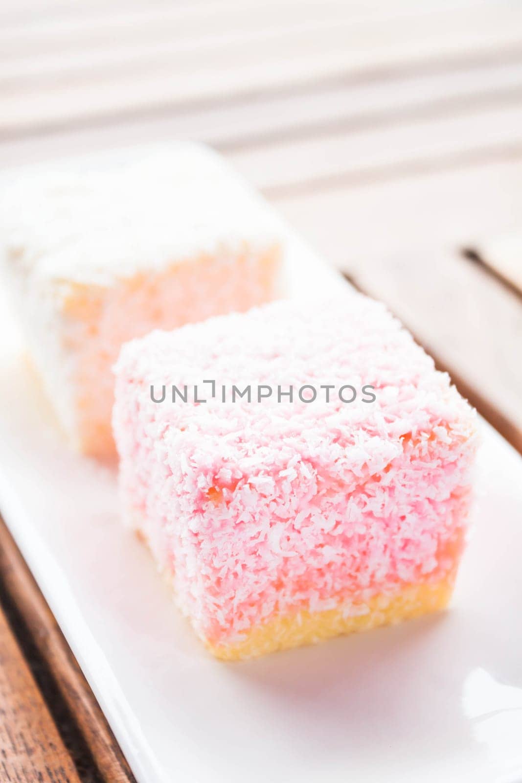 Lamington cakes on wood table, stock photo