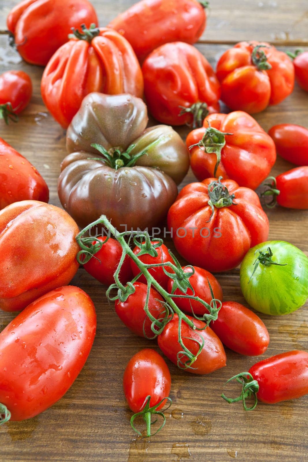 Selection of fresh ripe tomatoes of different varieties