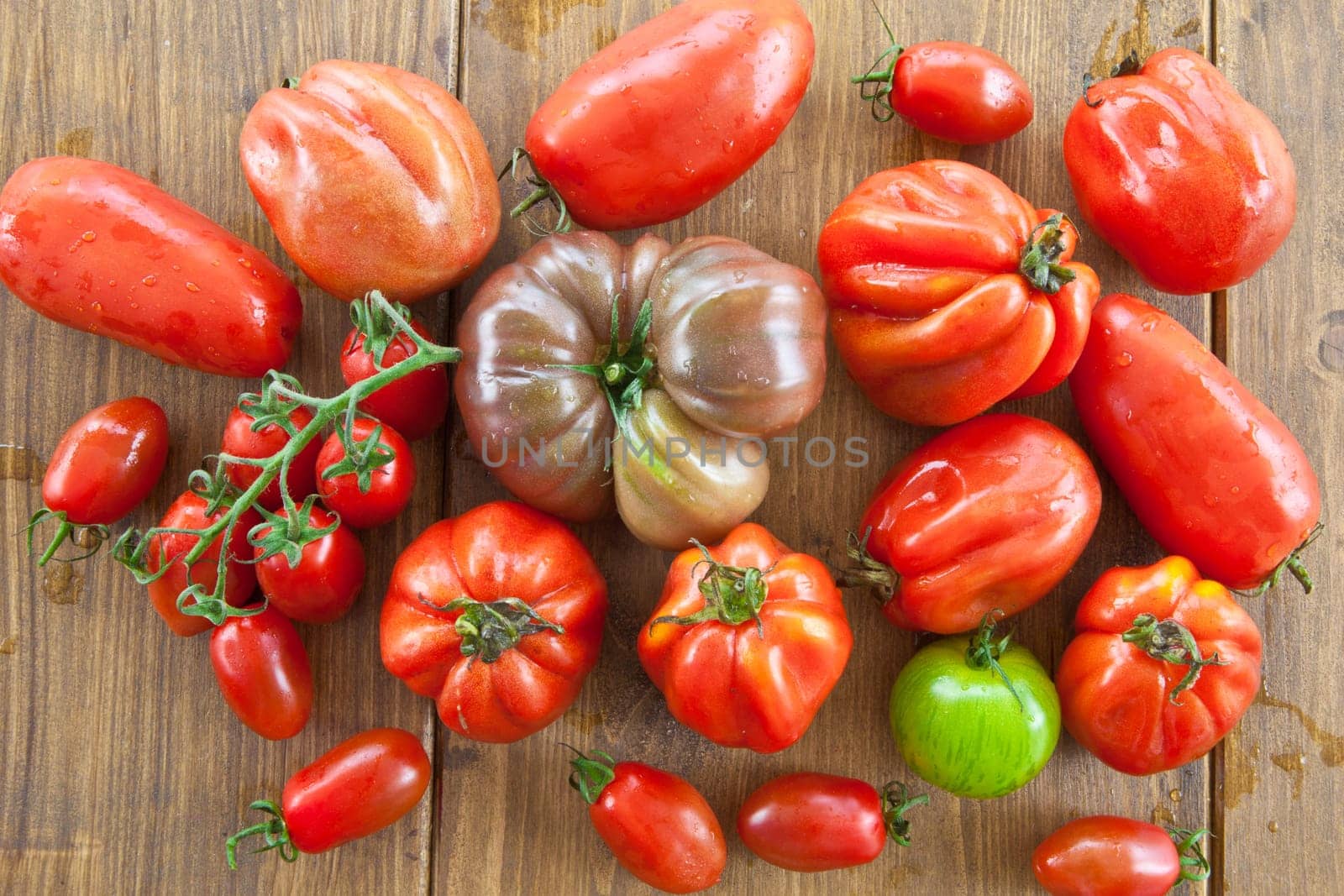Selection of fresh ripe tomatoes of different varieties