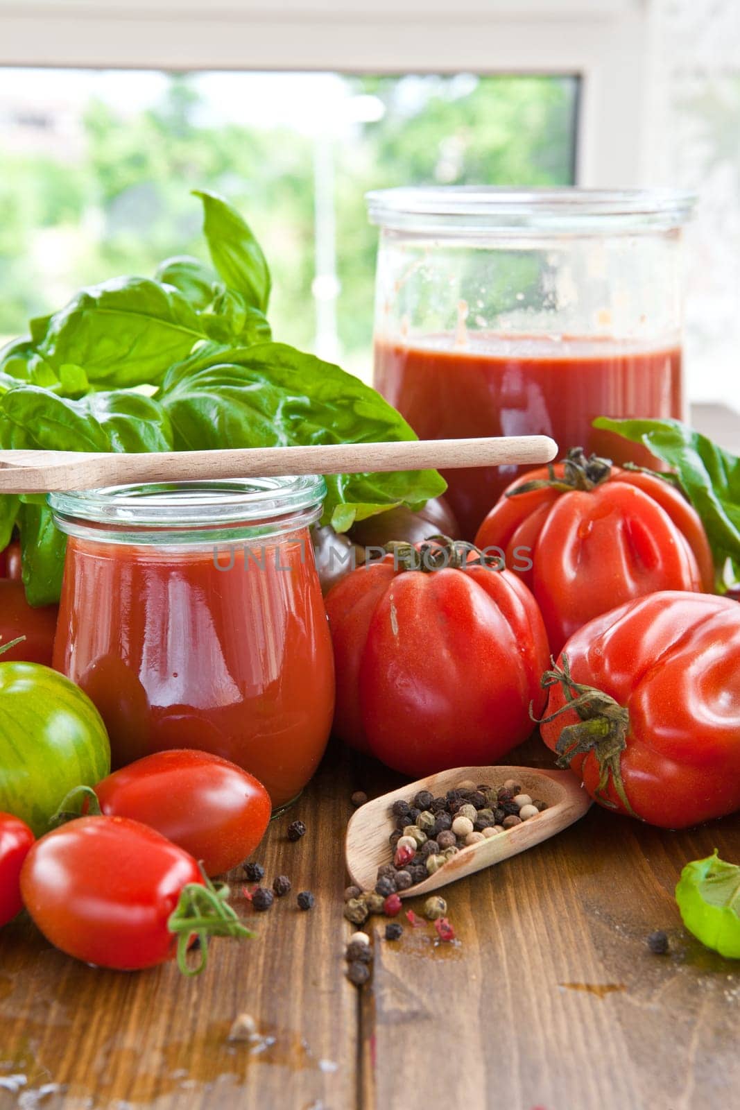 Homemade tomato sauce with fresh tomatoes and kraeuterns
