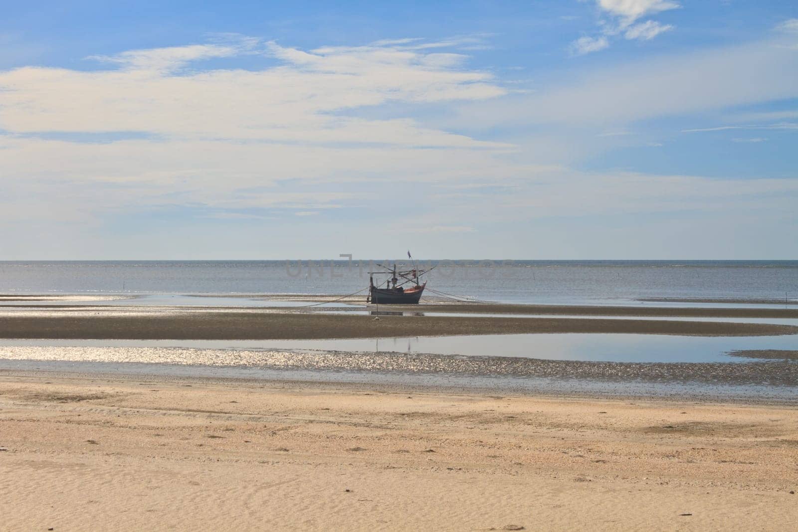 Fishing boat on the beach in summer