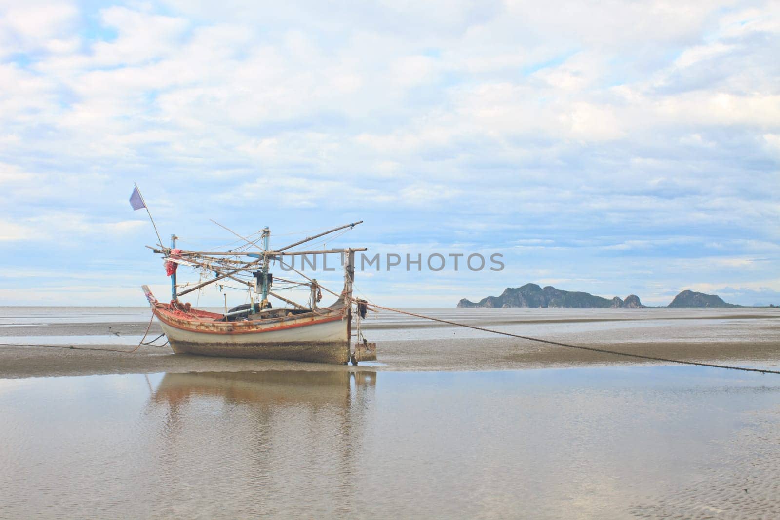 Fishing boat on the beach in summer