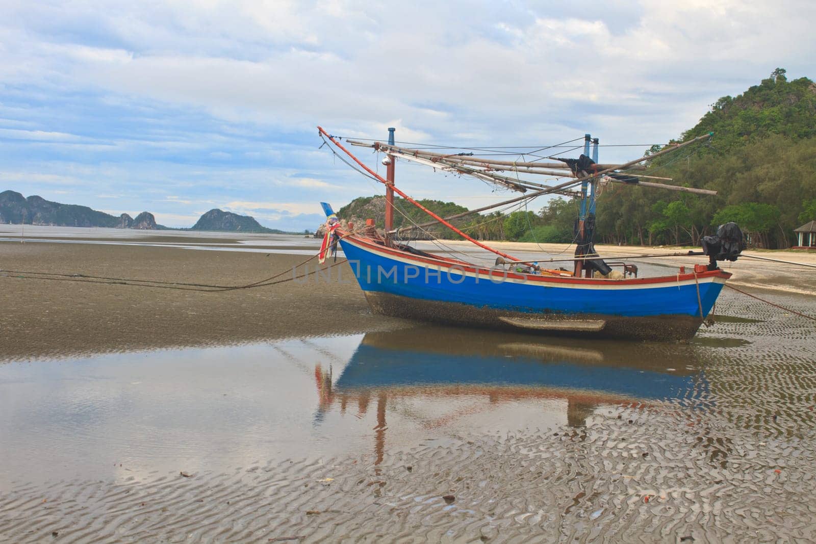 Fishing boat on the beach in summer