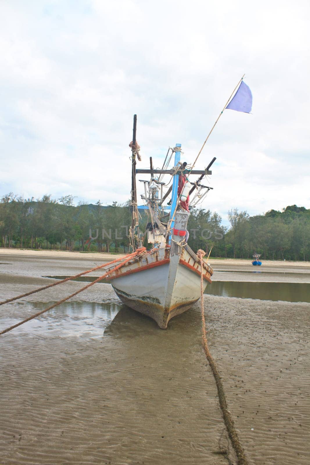 Fishing boat on the beach in summer