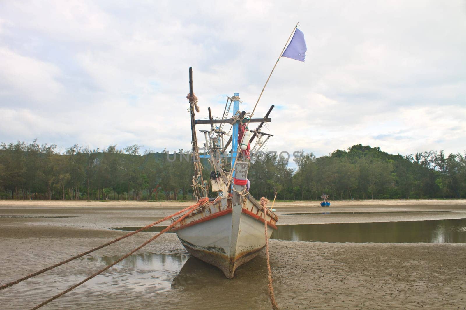 Fishing boat on the beach in summer