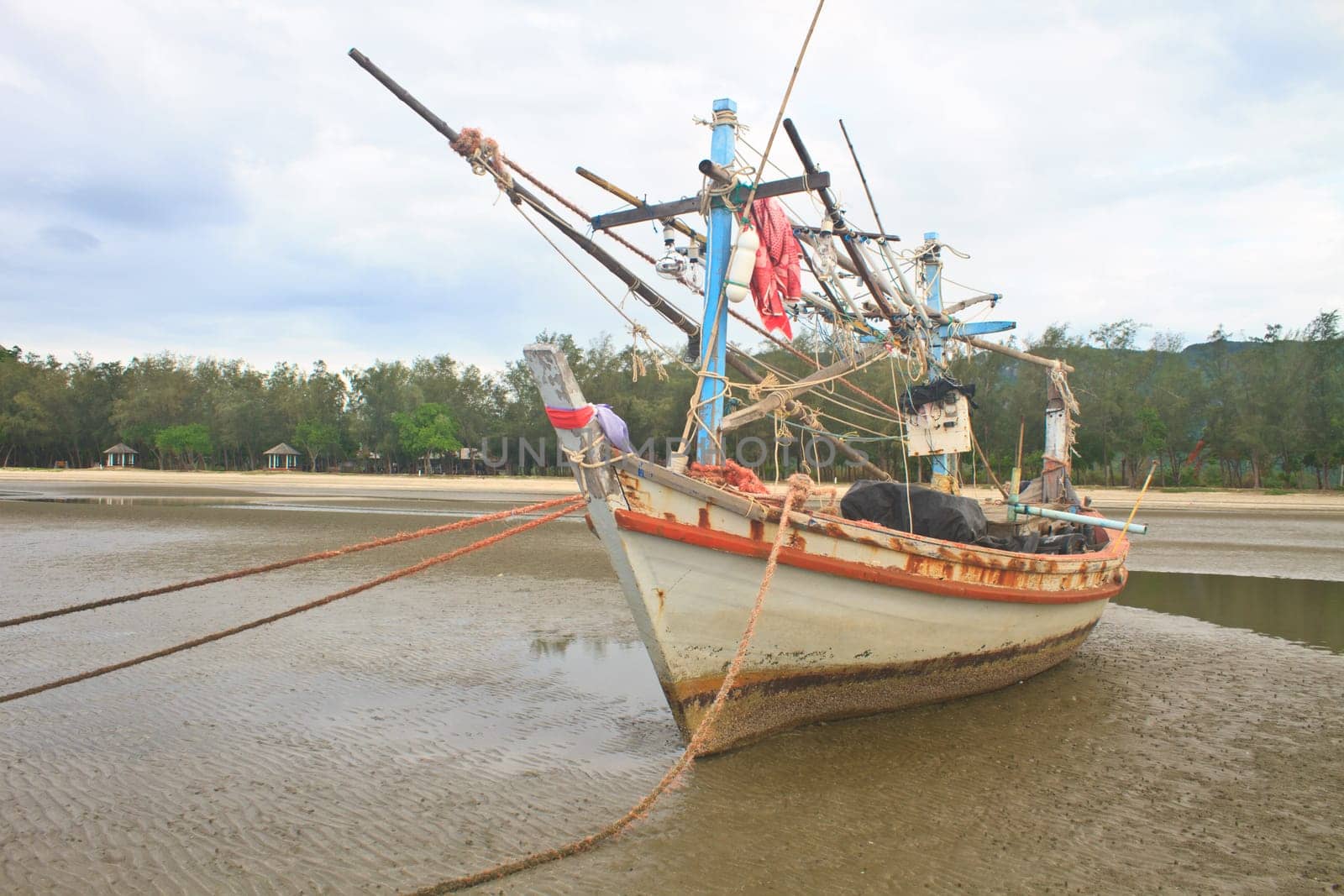 Fishing boat on the beach in summer
