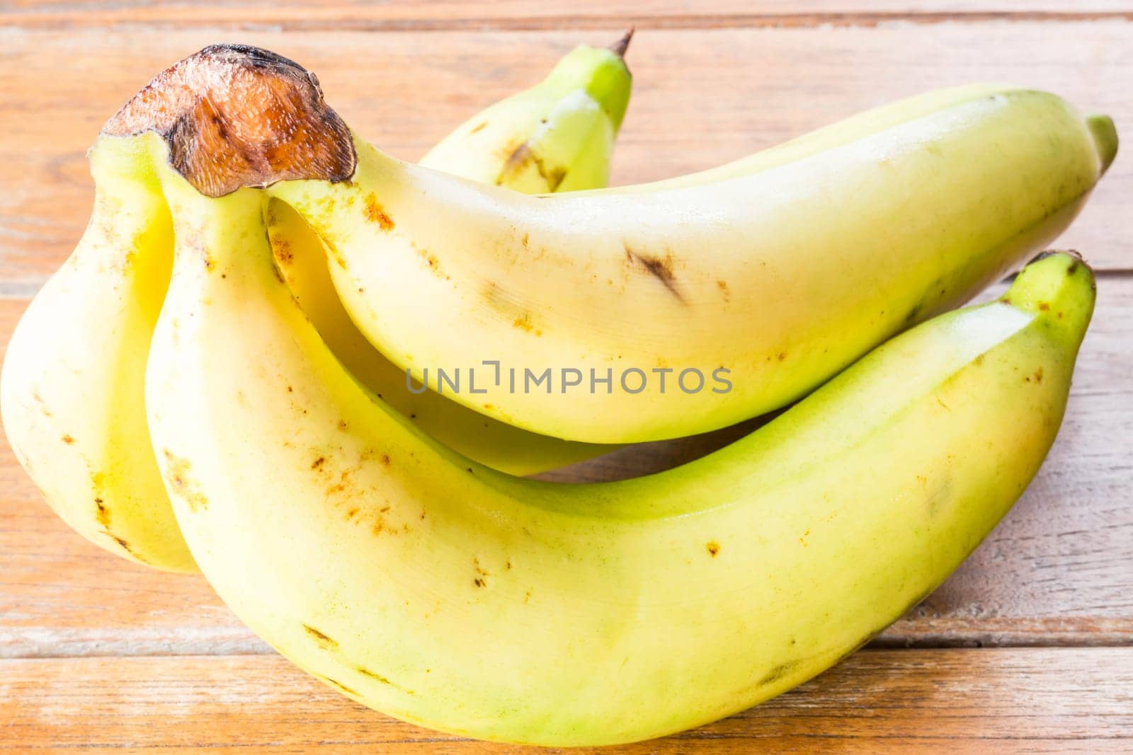 Bunch of bananas on wooden background, stock photo