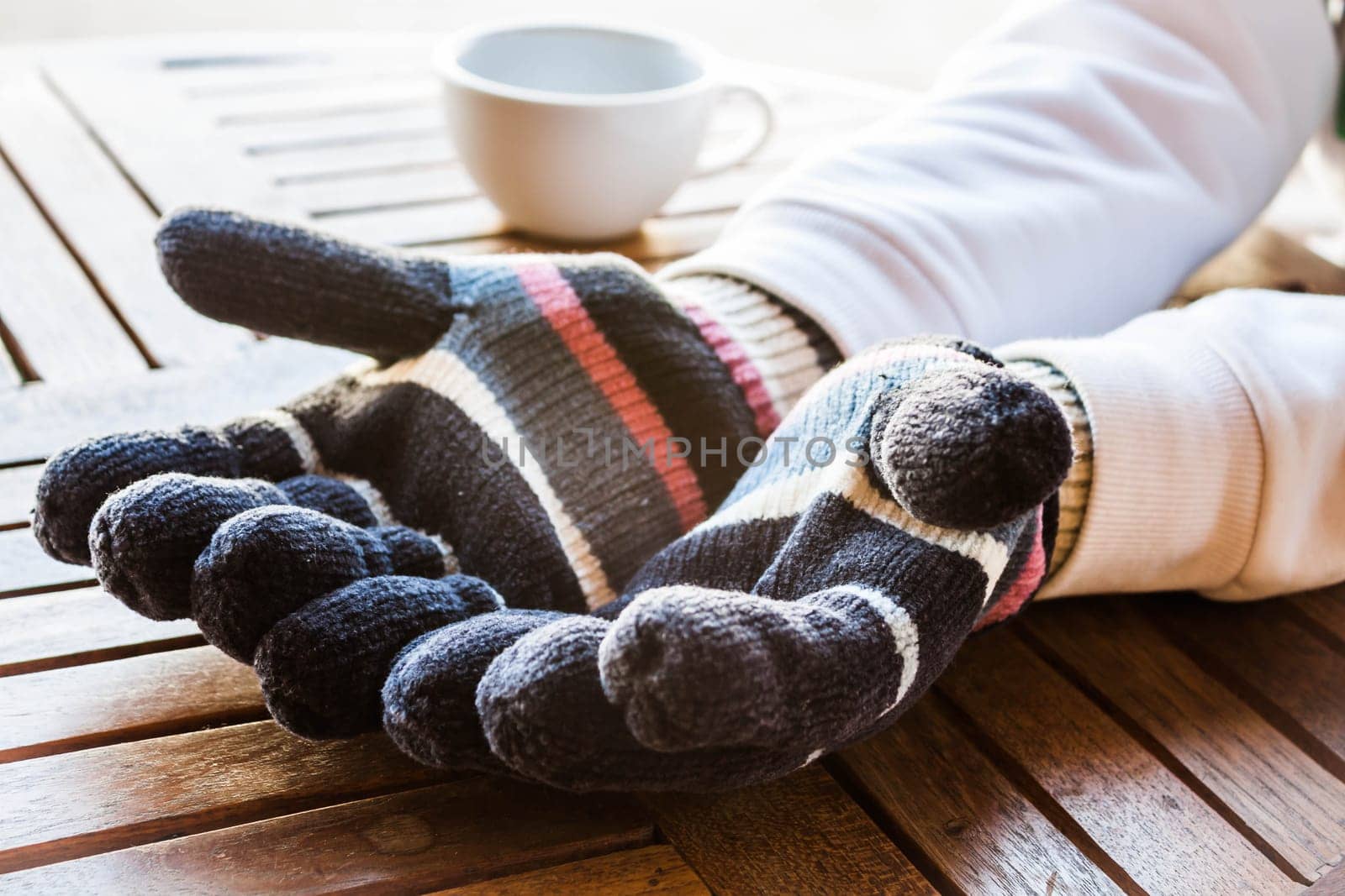 Warmly hands in wool gloves, stock photo