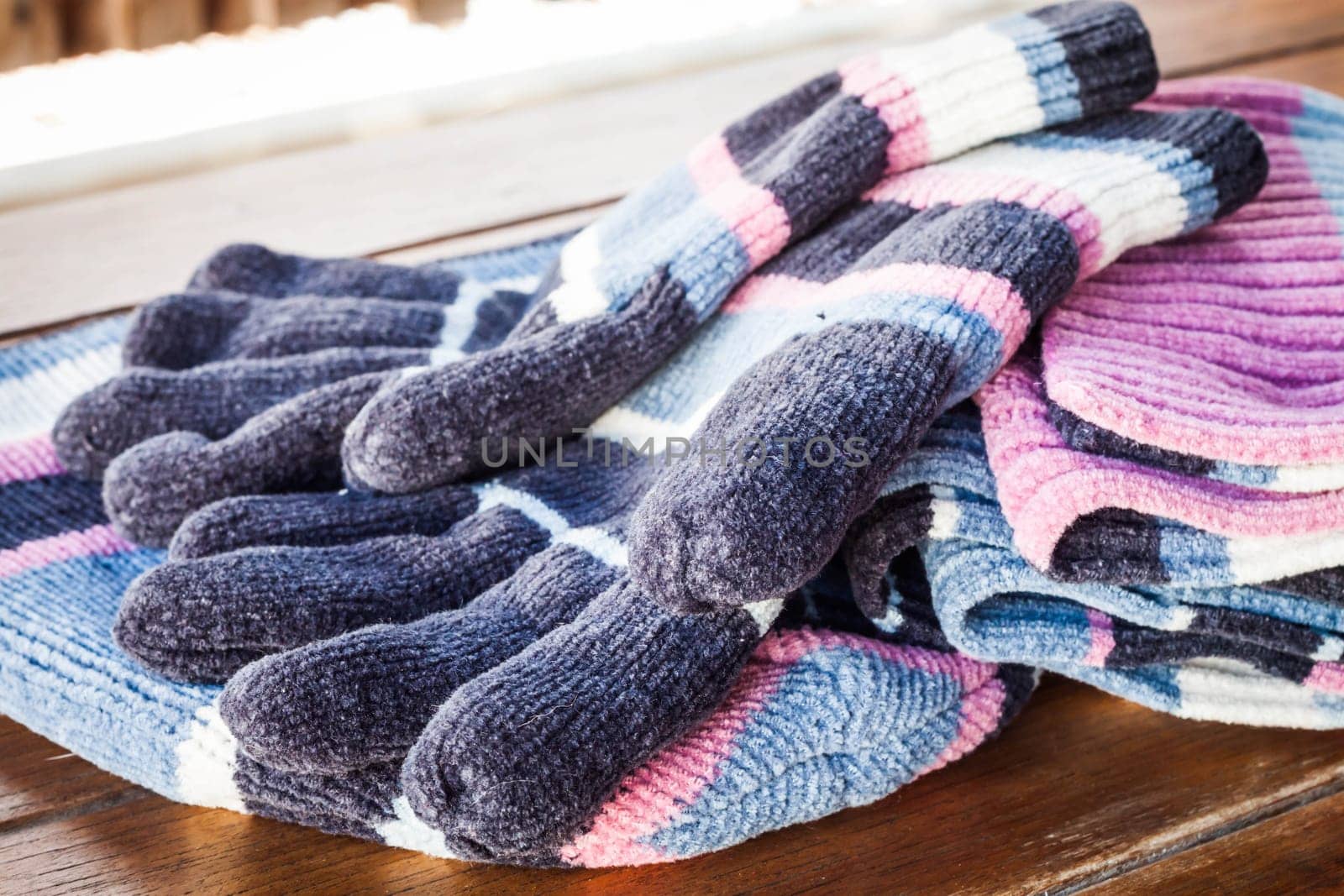 Set of winter wool accessories on wood table
