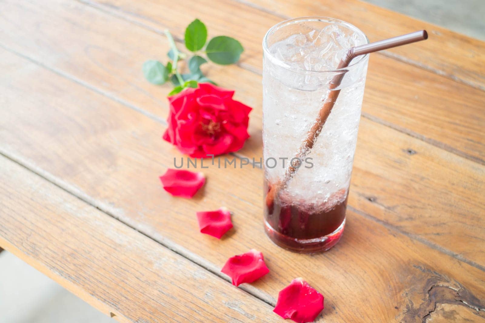 Serving pomegranate drink on wood table, stock photo