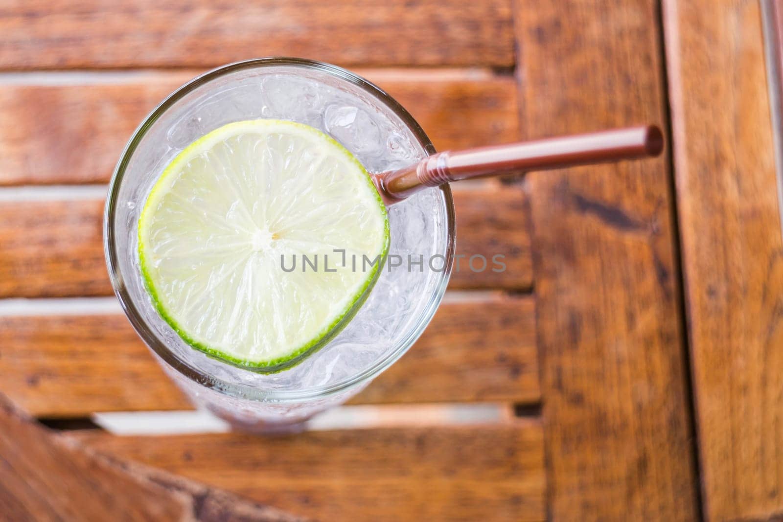 Glass of iced lemon juice up close, stock photo