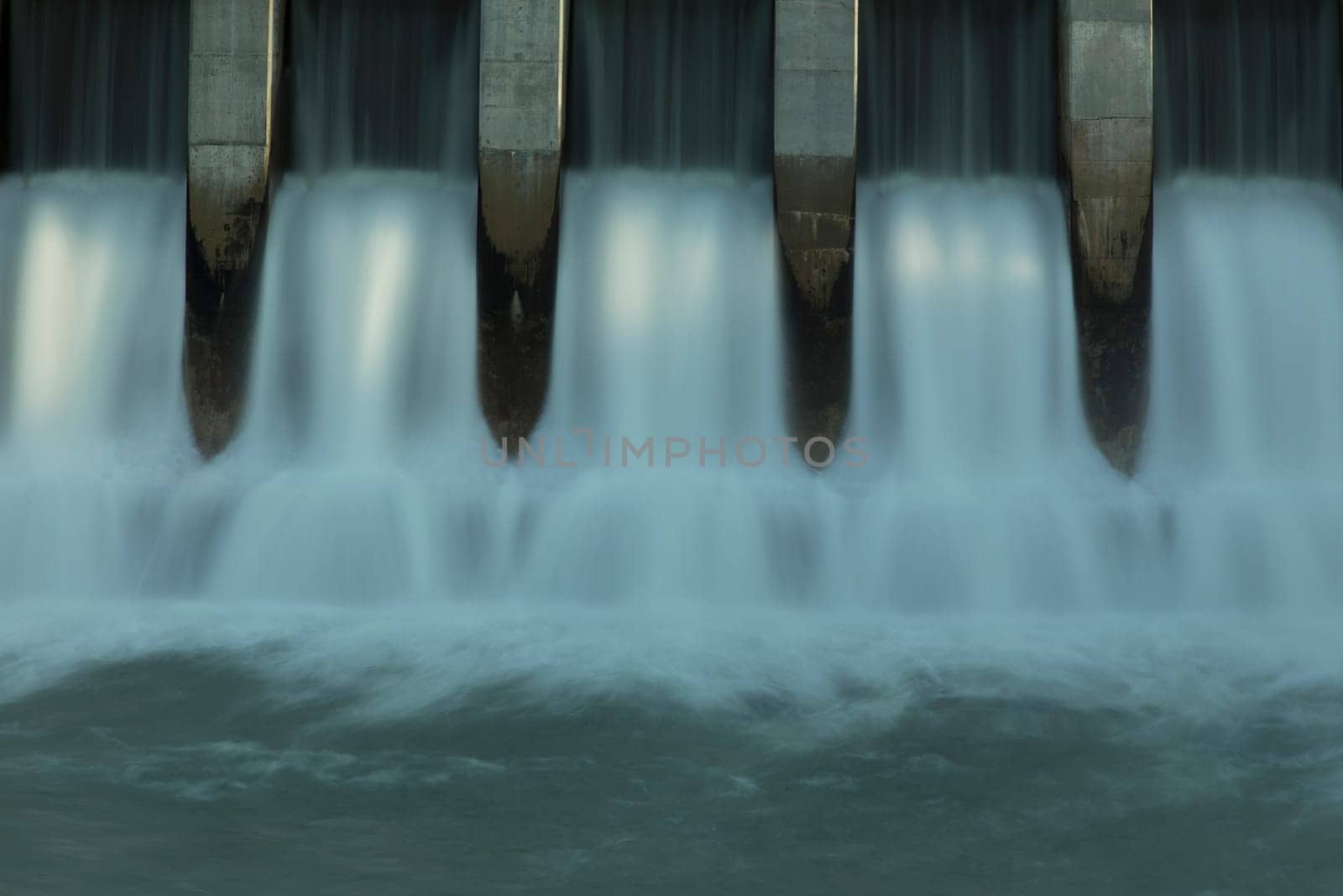 Close up time exposure of the spillway on the Kananaskis hydroelectric dam on the Bow River, Alberta, Canada