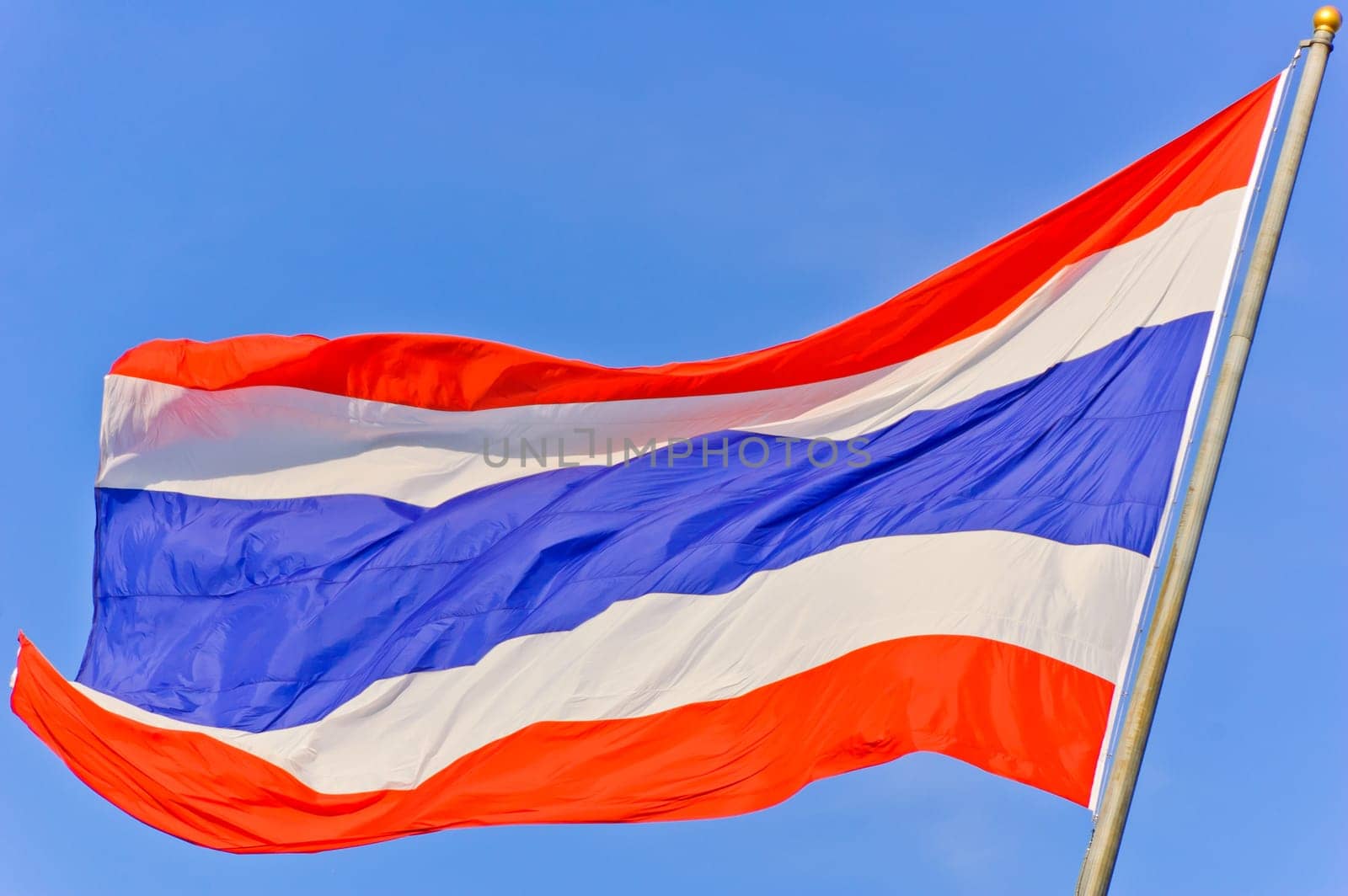 Flag of Thailand against blue sky